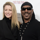 Paige Butcher, left, and Eddie Murphy attend “SUBCONSCIOUS” by Bria Murphy Gallery Opening in Los Angeles on Nov. 20, 2016.